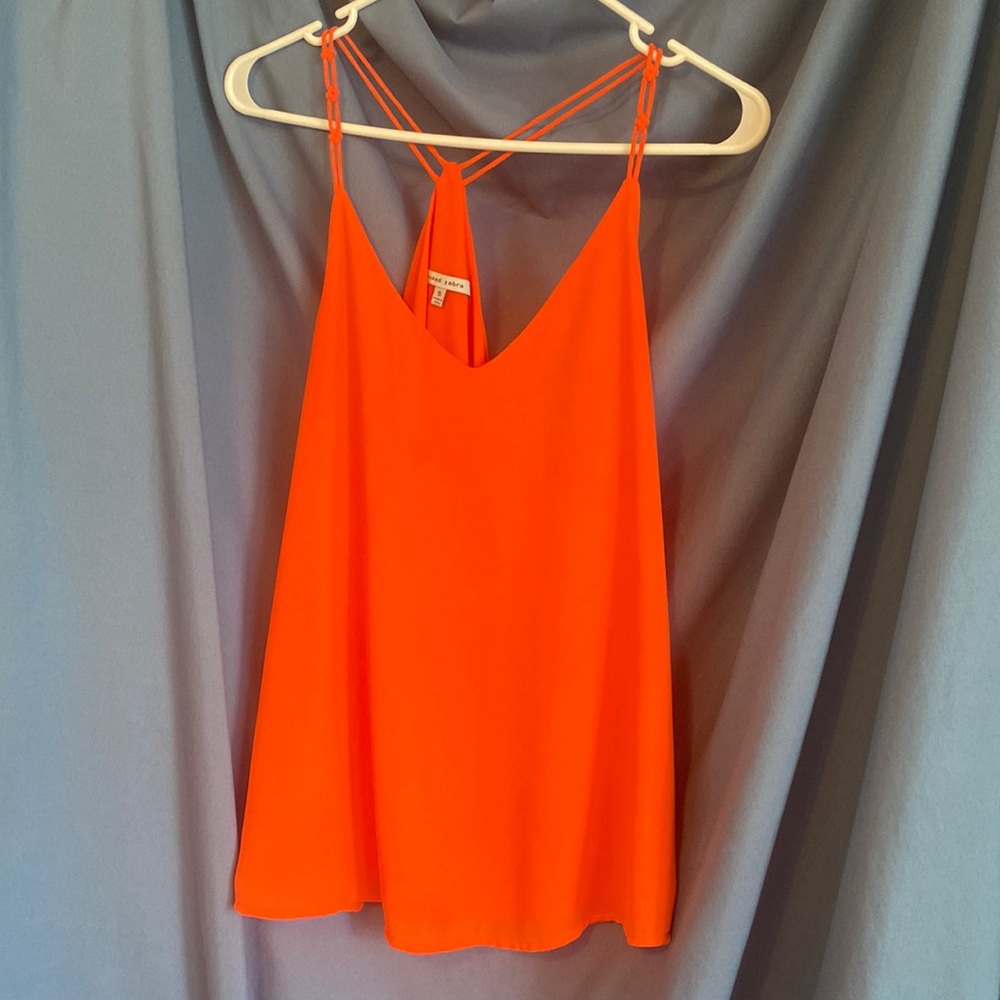 Orange non-see through tank top made with sheer-like material. Great for gameday